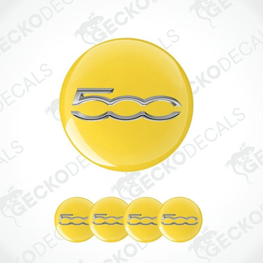 Yellow Fiat emblem with silver logo on a white background