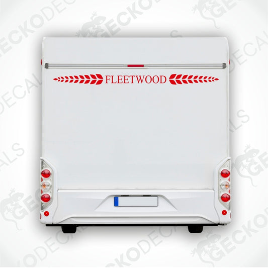 A die cut sticker with the text 'Fleetwood' displayed on the rear of a white caravan, bordered with red decorative elements.