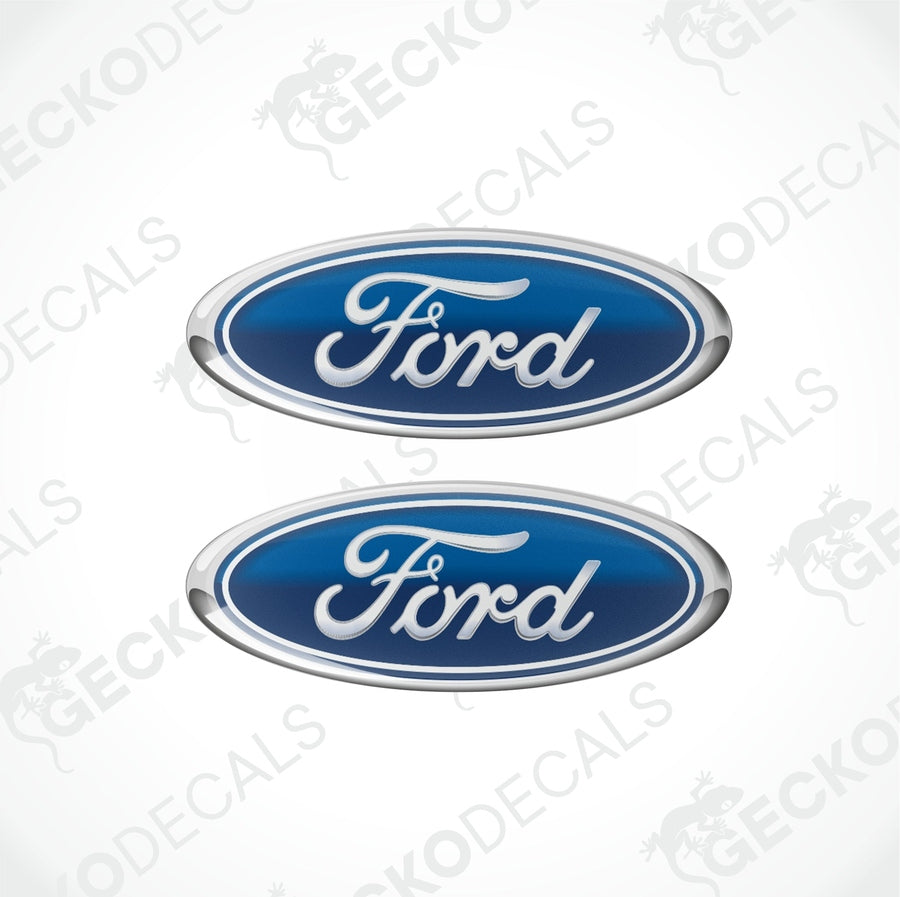 Two blue oval-shaped Ford vehicle decals with white and silver text.