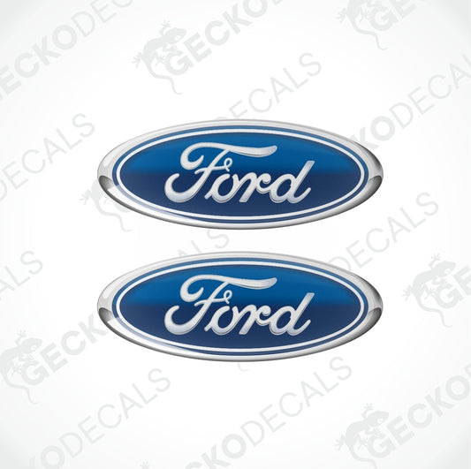 Two blue oval-shaped Ford vehicle decals with white and silver text.