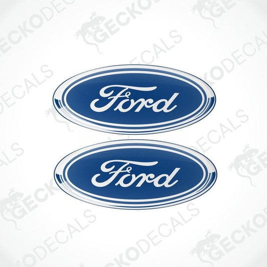 Two blue oval-shaped vinyl decals with the 'Ford' brand logo in white lettering.