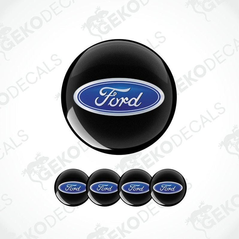 A set of four black vinyl decals with the Ford logo in blue.