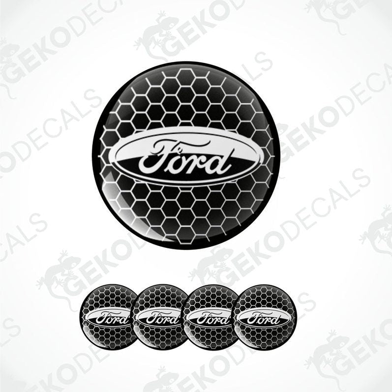 A set of four black vinyl stickers with the FORD brand logo, designed to be applied on car wheel caps.