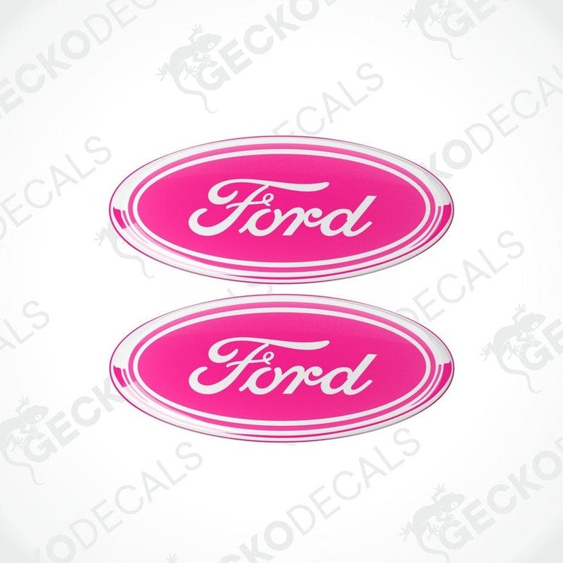 Two pink oval-shaped vinyl decals with the 'Ford' brand logo in white lettering.