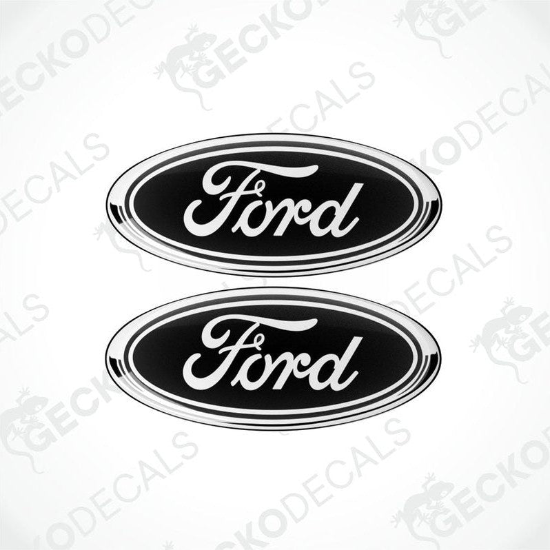 Two black oval-shaped vinyl decals with the 'Ford' brand logo in white lettering.