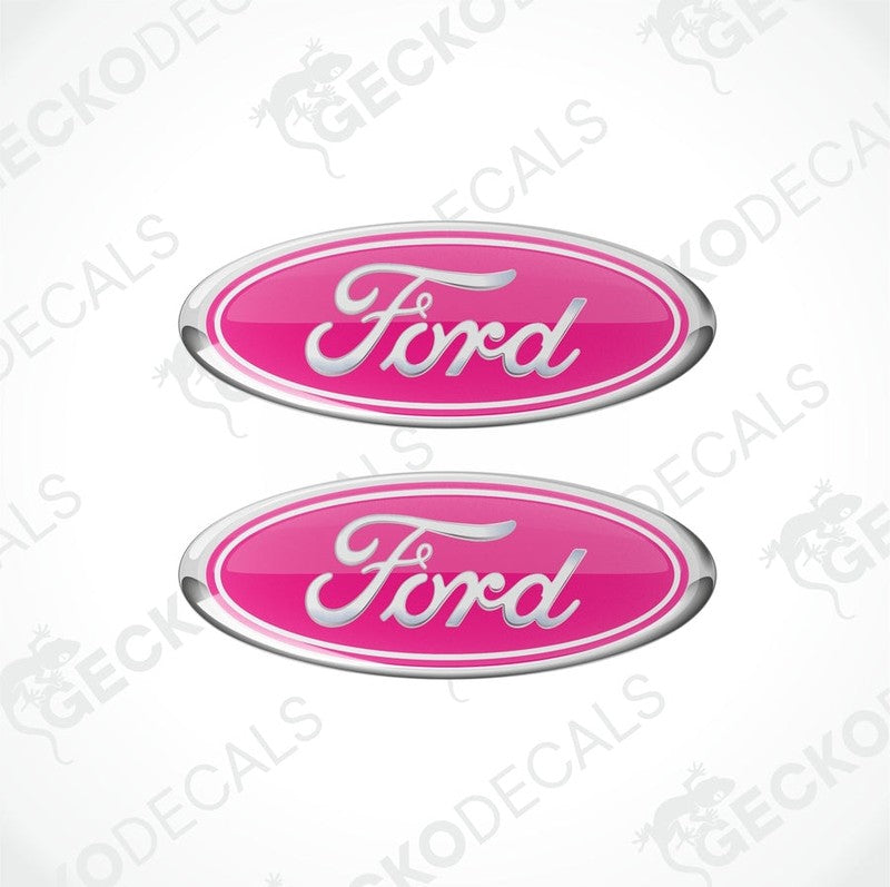 Two pink oval-shaped Ford vehicle decals with white and silver text.
