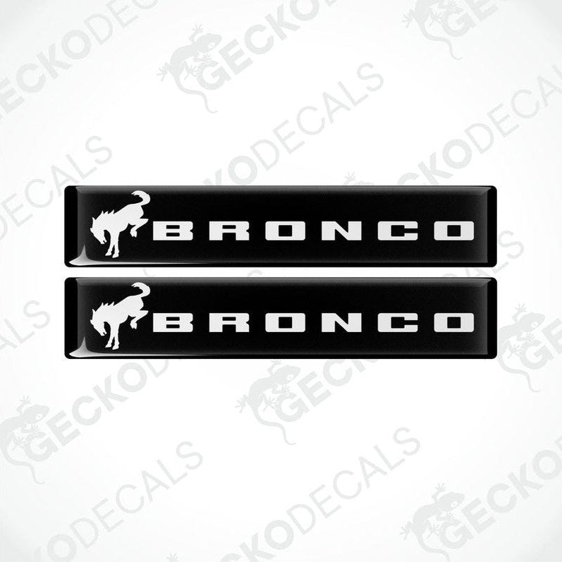 Two black and white vinyl decals with the text 'BRONCO' and a bronco animal graphic on a white background.