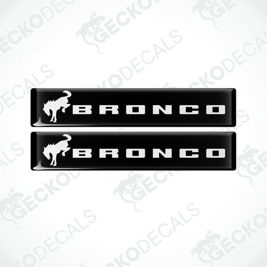 Two black and white vinyl decals with the text 'BRONCO' and a bronco animal graphic on a white background.