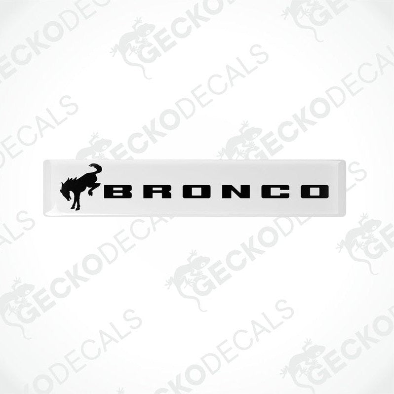  White and black vinyl decals with the text 'BRONCO' and a bronco animal graphic on a white background.