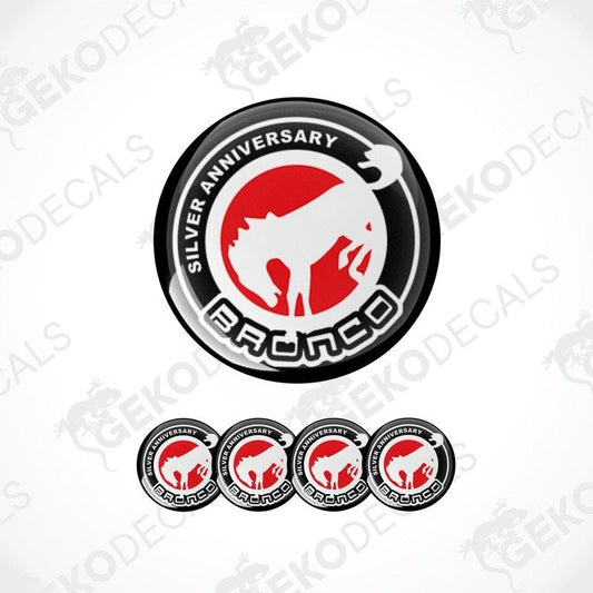 A set of four round vehicle decals featuring the text 'SILVER ANNIVERSARY' and the Ford Bronco logo in red and white on a black background.