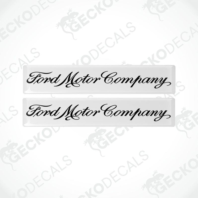 Two white vinyl decals with the Ford Motor Company logo in black.