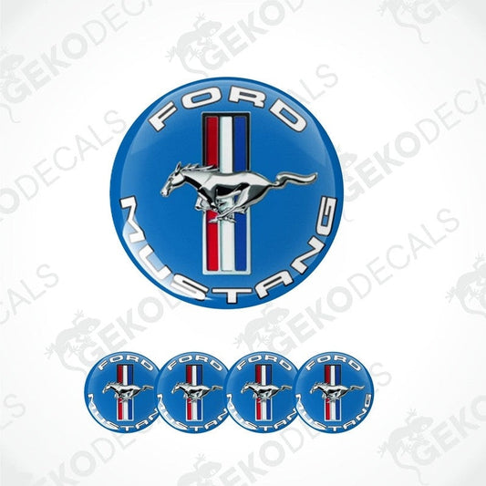 A set of four blue vinyl stickers with a horse and the text 'FORD MUSTANG' on them.