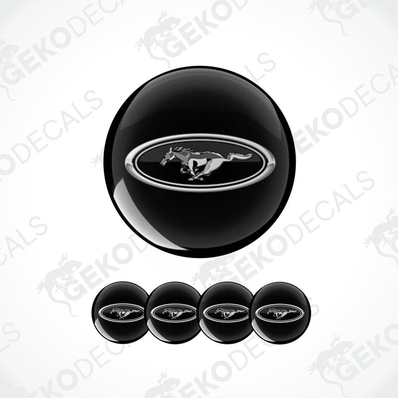 A set of four black vinyl decals with the Ford logo in white.