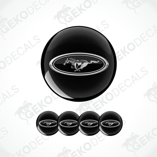 A set of four black vinyl decals with the Ford logo in white.