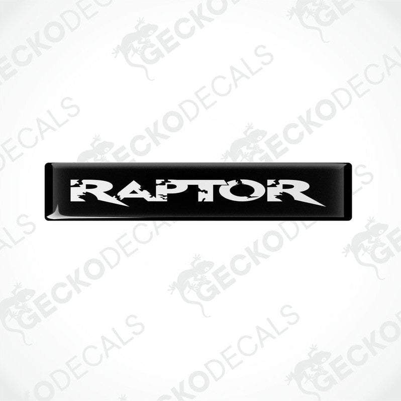  Black and white rectangular car decals with the word 'RAPTOR' written on them in bold lettering.