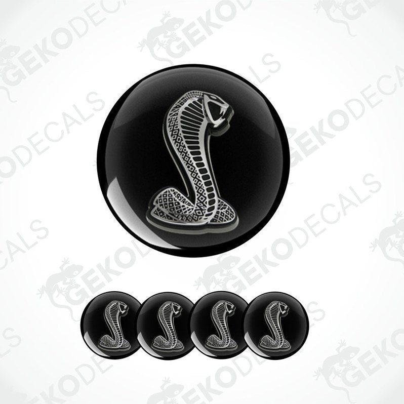 A set of black vinyl decals with a white cobra design, typically associated with the FORD SHELBY brand.