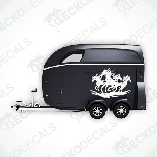 A black trailer with a die cut decal featuring four running horses on the side.