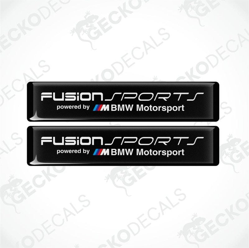 Two black vinyl decals with white text and the BMW Motorsport logo, one above the other, on a white background.