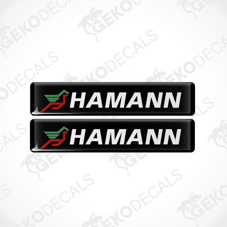 Two black vinyl stickers with the HAMANN brand logo in red and green.