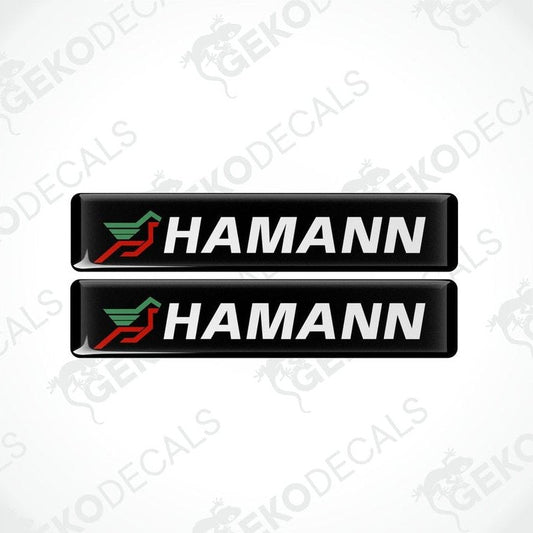 Two black vinyl stickers with the HAMANN brand logo in red and green.