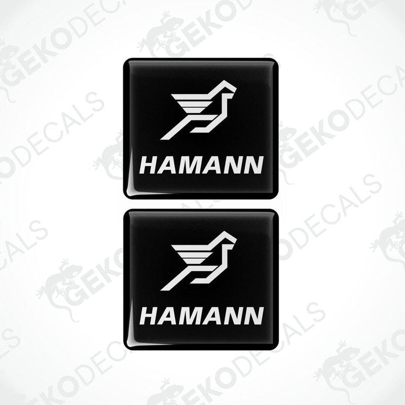 Two black vinyl stickers with the HAMANN logo, one with the logo facing up and the other with the logo facing down.