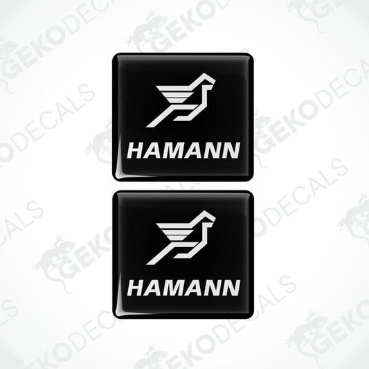 Two black vinyl stickers with the HAMANN logo, one with the logo facing up and the other with the logo facing down.