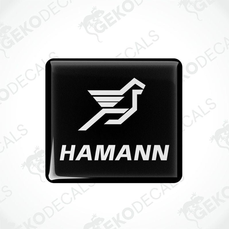 Black vinyl stickers with the HAMANN logo, one with the logo facing up and the other with the logo facing down.