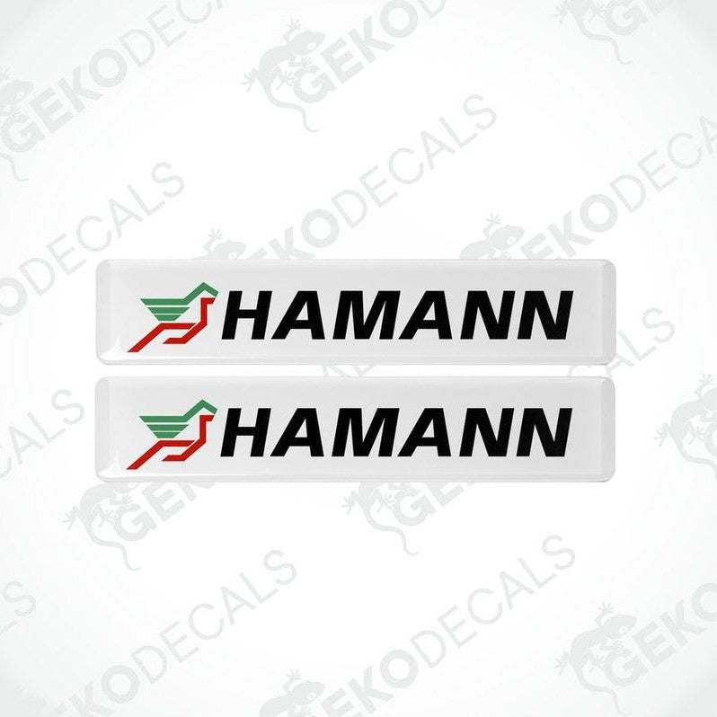 Two white vinyl stickers with the HAMANN brand logo in red and green.