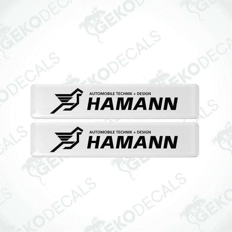 Two rectangular white vinyl decals with the black HAMANN Motorsport GMBH logo.
