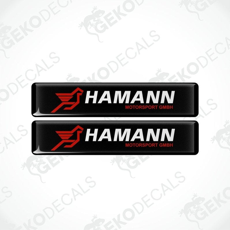 Two rectangular black vinyl decals with the red and white HAMANN Motorsport GMBH logo.