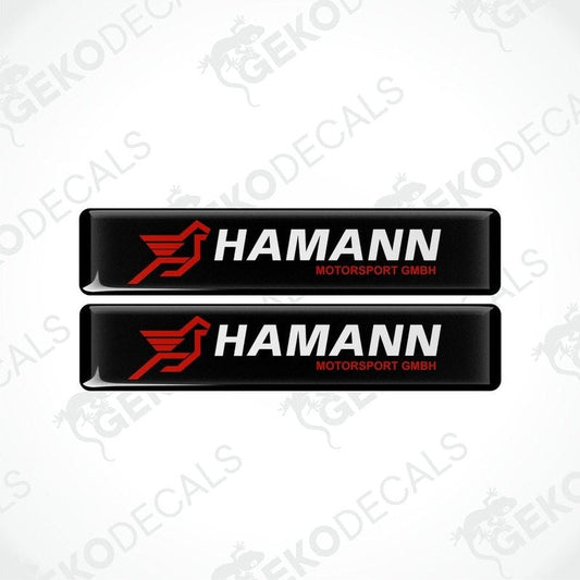 Two rectangular black vinyl decals with the red and white HAMANN Motorsport GMBH logo.
