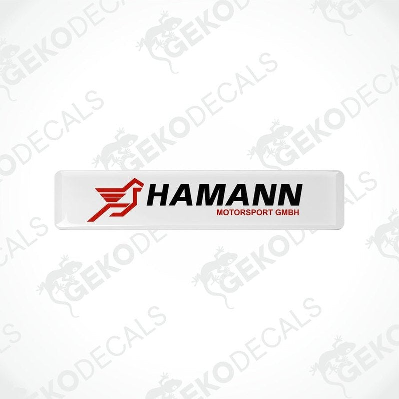 Rectangular white vinyl decals with the red and black HAMANN Motorsport GMBH logo.