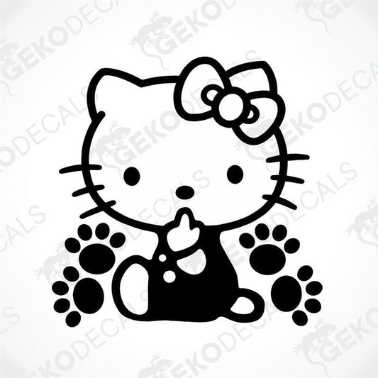 A black and white sticker of Hello Kitty with a bow on her head, sitting with her eyes closed.