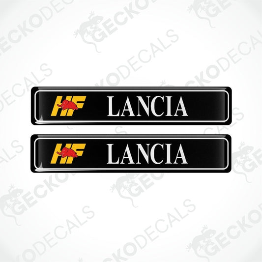 Two black vinyl stickers with the text 'LANCIA' and the logo 'HF' in yellow and red.