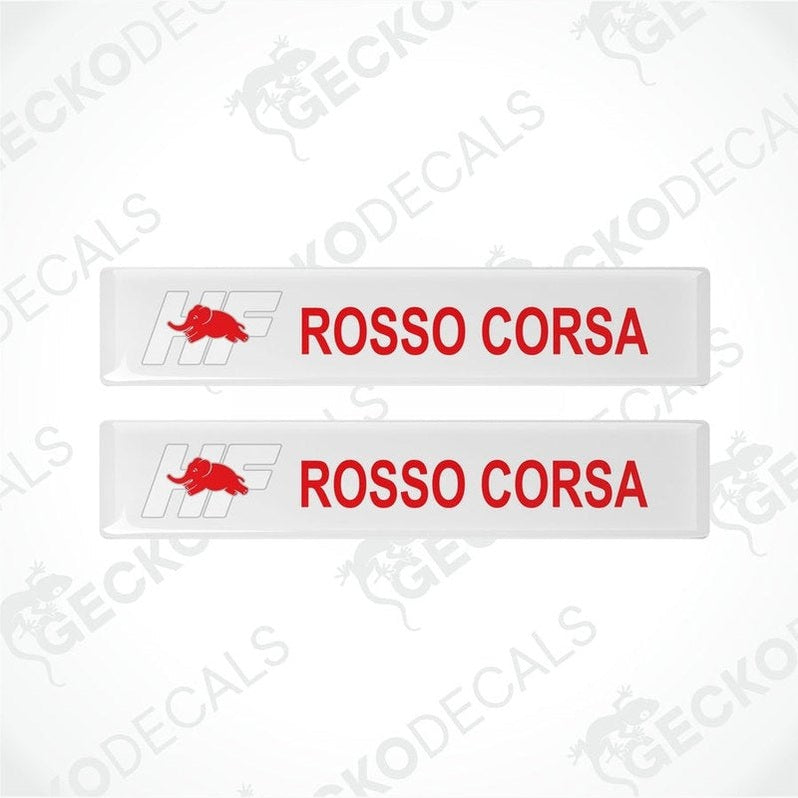 Two white vinyl decals with 'LANCIA ROSSO CORSA' text in white and red