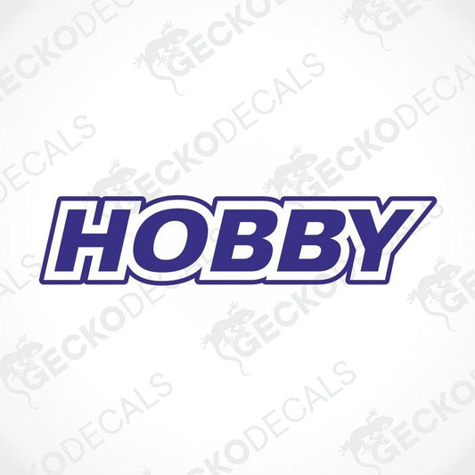 A white die cut sticker with the word 'HOBBY' in blue uppercase letters.
