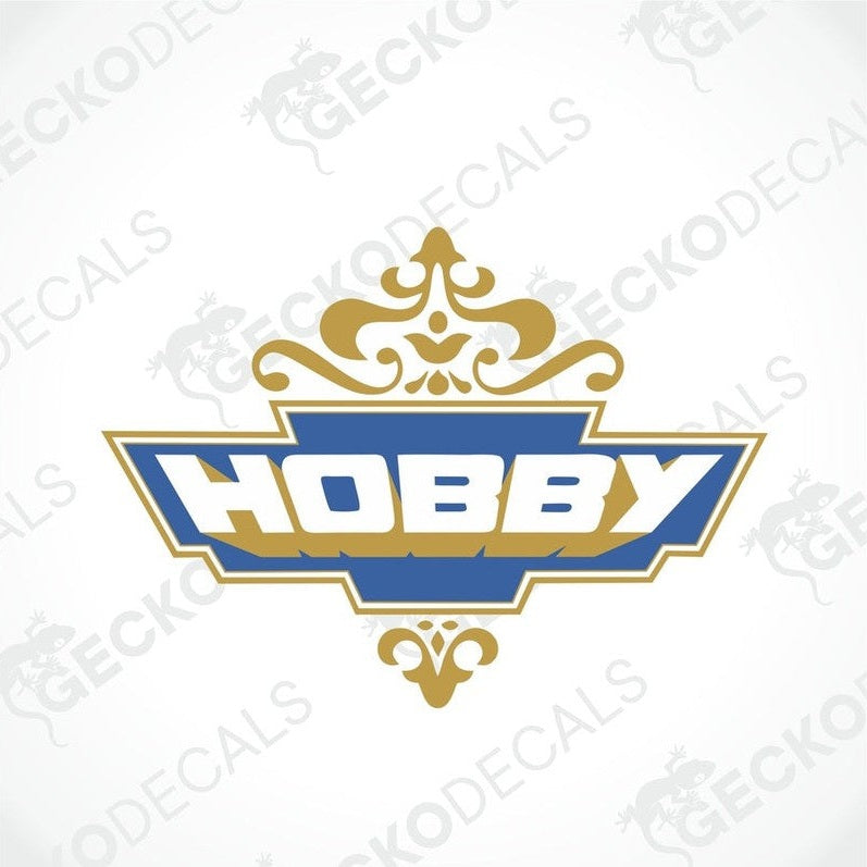 A printed die cut sticker with the word 'HOBBY' in bold letters and a decorative border.