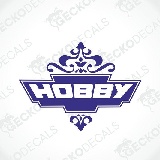 A die cut decal with the word 'HOBBY' in bold letters, surrounded by a decorative floral-like pattern, predominantly in blue color.