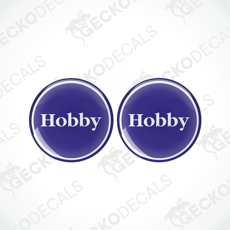 Two blue vinyl stickers with the word 'HOBBY' in the center, placed against a white background with the Gecko Decals logo.