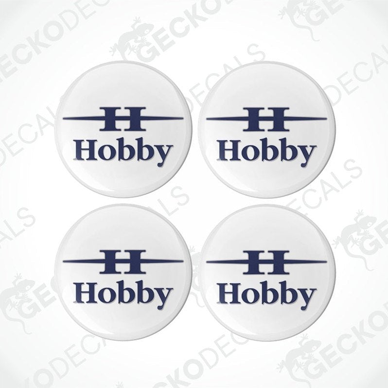 A set of four white vinyl stickers with the word 'HOBBY' printed in blue. Each sticker has a visible Gecko Decals logo at the bottom.