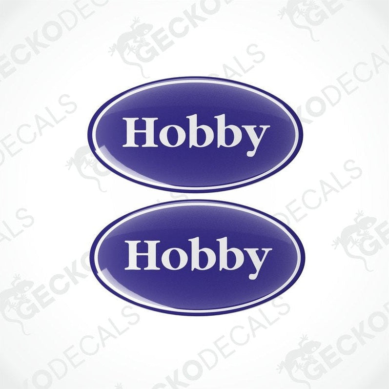 Two blue vinyl stickers with the word 'HOBBY' in the center.