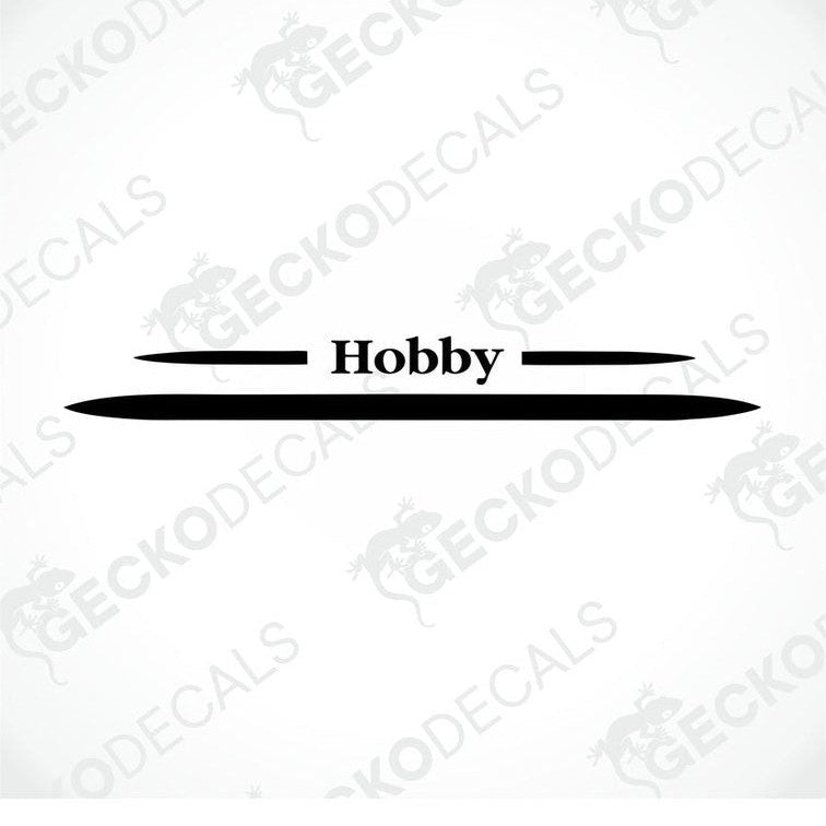 A white caravan with a red horizontal decal on the rear side, featuring the brand name 'Hobby' in bold lettering.