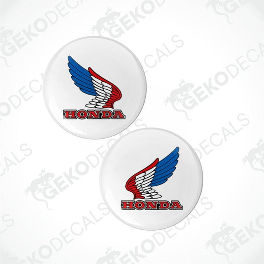 Two Honda logo stickers with red, white, and blue design on a white background.
