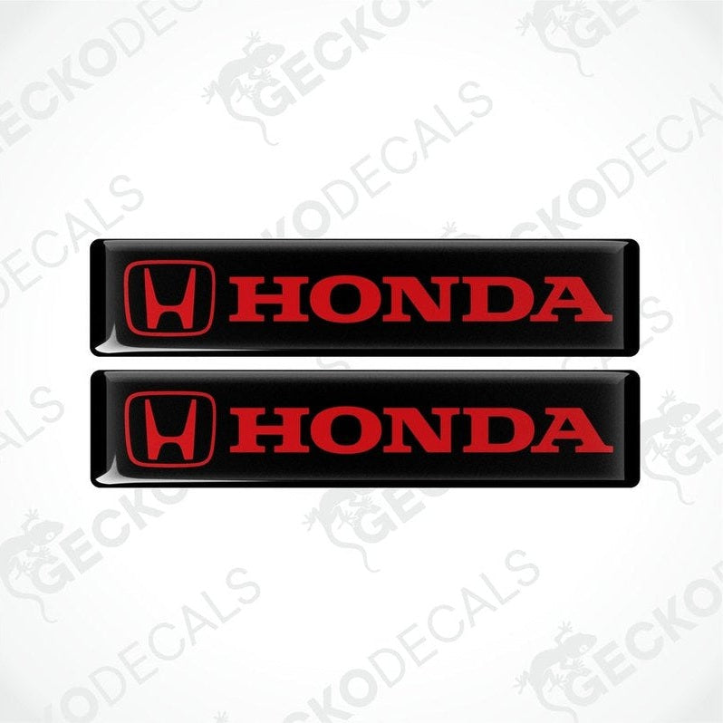 Two black vinyl stickers with the Honda logo in red and white.
