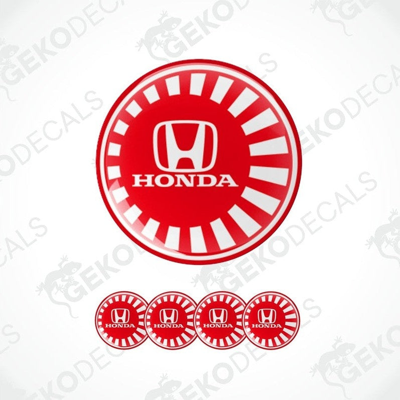 A set of four red and white vinyl decals with the HONDA logo, designed for use as car wheel caps or stickers.