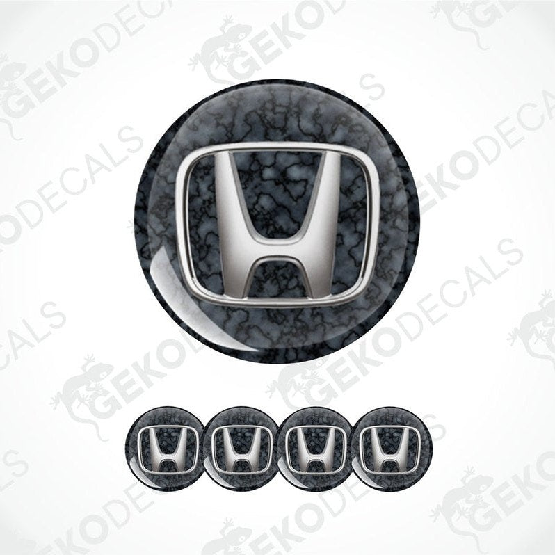 A set of vinyl decals with a polyurethane coating featuring the HONDA logo, displayed on a white background.