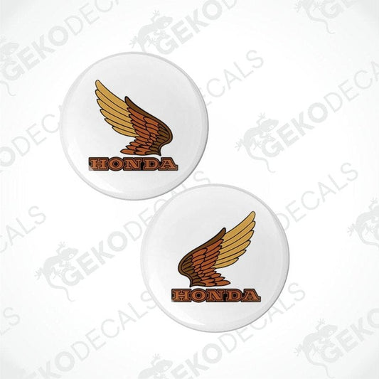 Two Honda logos on white buttons with a brand watermark.