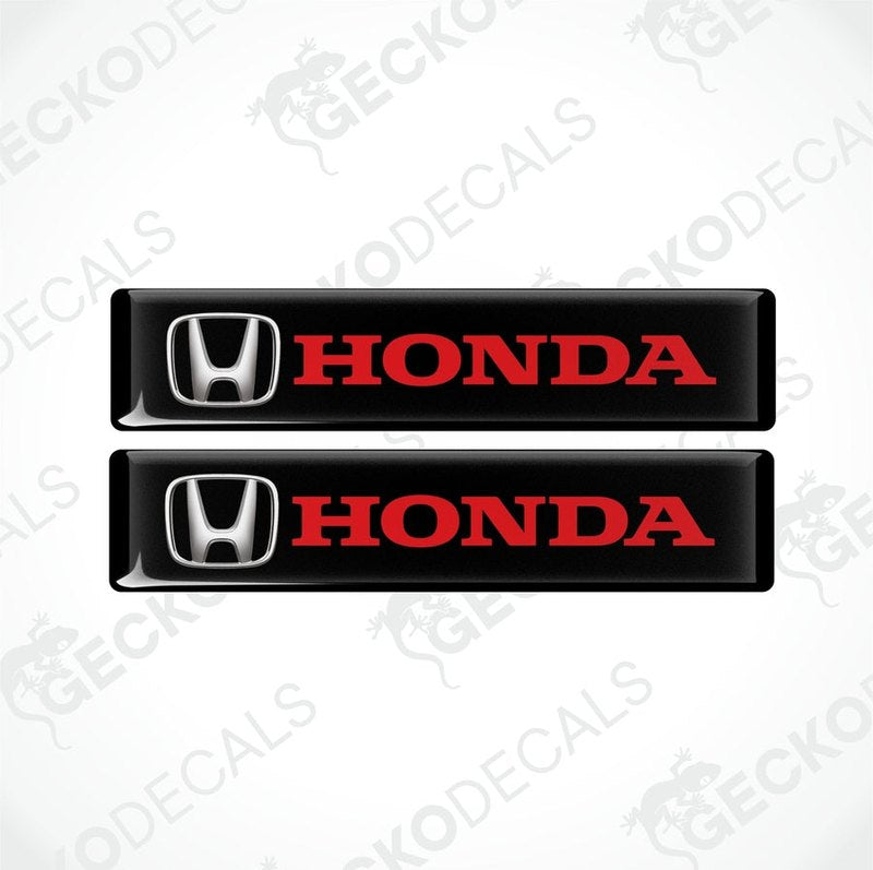 Two black vinyl stickers with the Honda logo in red and silver.
