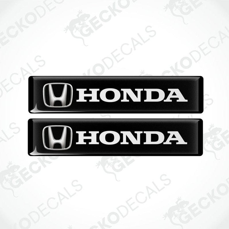 Two black vinyl decals with the white text 'HONDA' and the iconic HONDA logo on each decal.