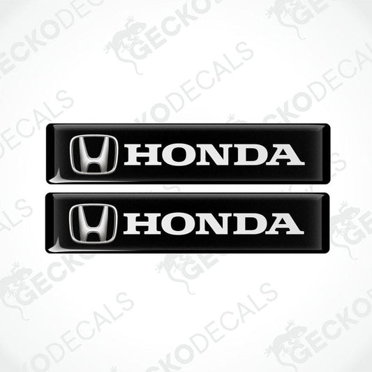 Two black vinyl decals with the white text 'HONDA' and the iconic HONDA logo on each decal.